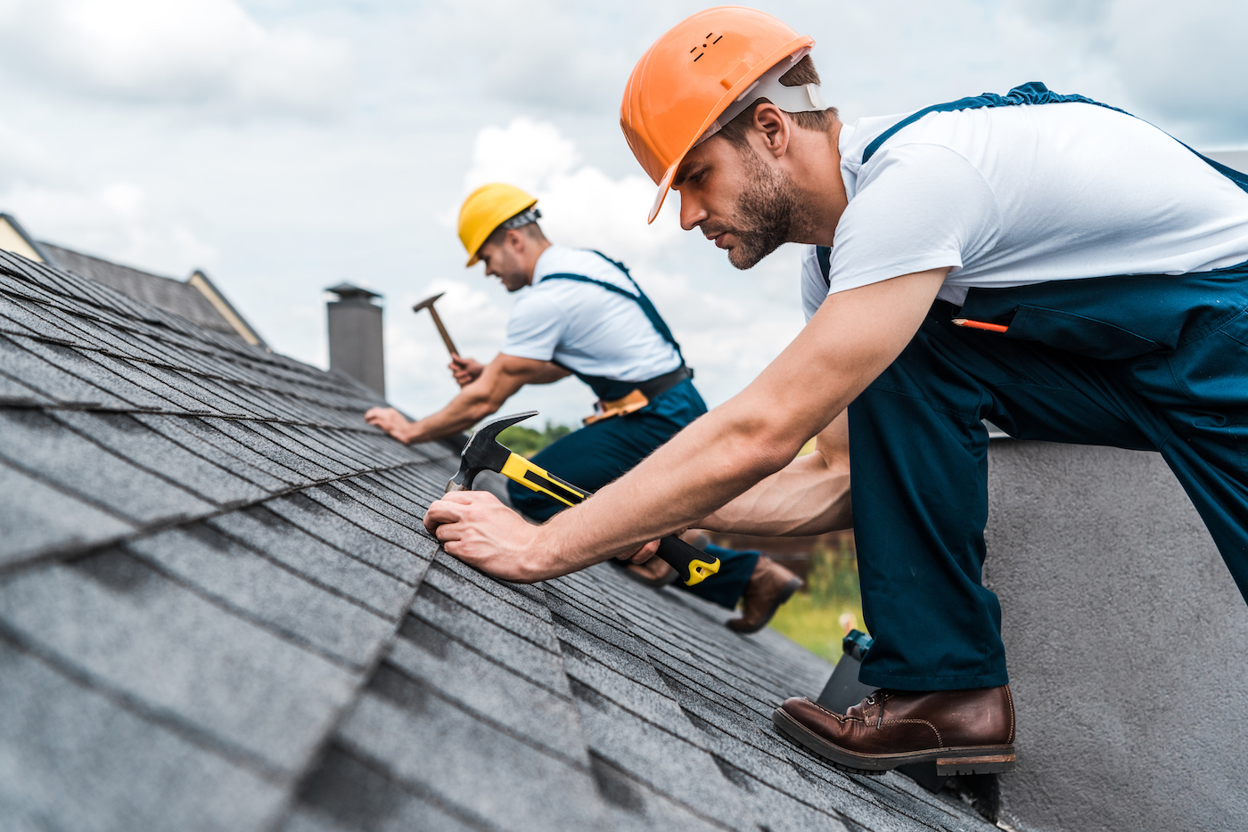 two houston roof workers completing contact-less roof repairs