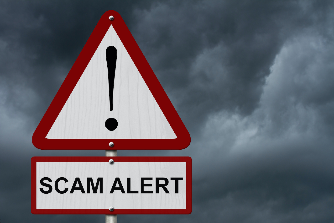 Scam alert sign against a thunderstorm background