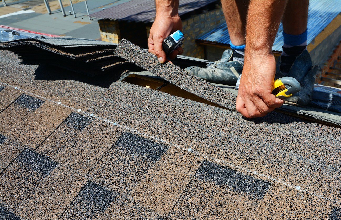 houston roof experts installing brand new roof shingles for Houston roof replacement
