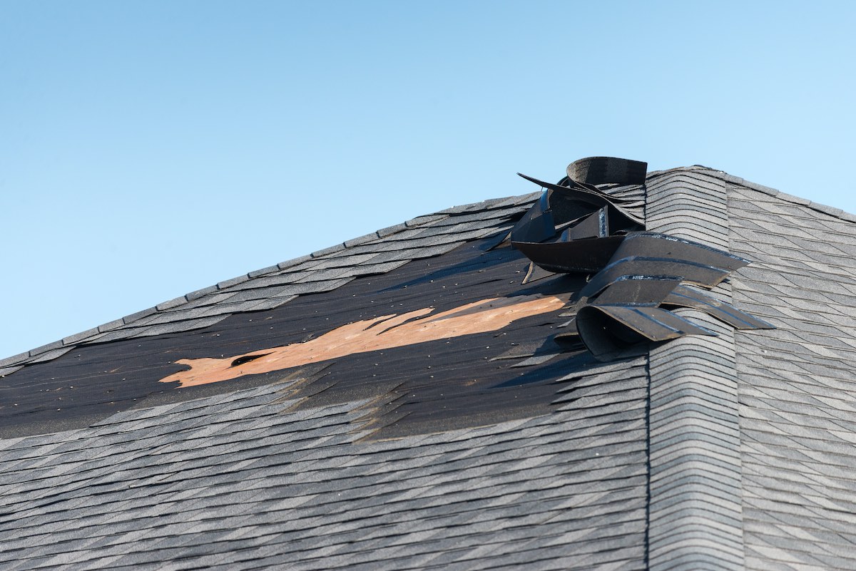 houston roof with torn off shingles due to wind damage
