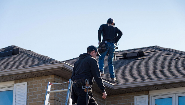 houston roof experts conducting a roof inspection in the winter