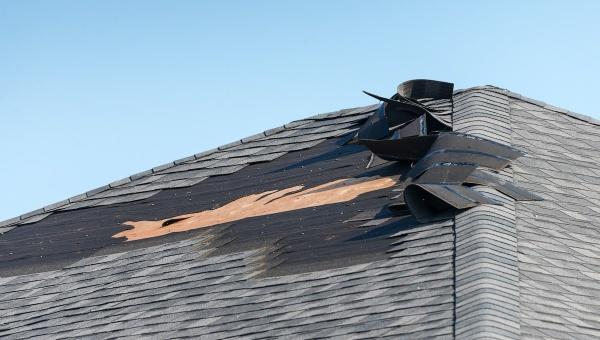 Cinco Ranch shingles affected by wind damage.
