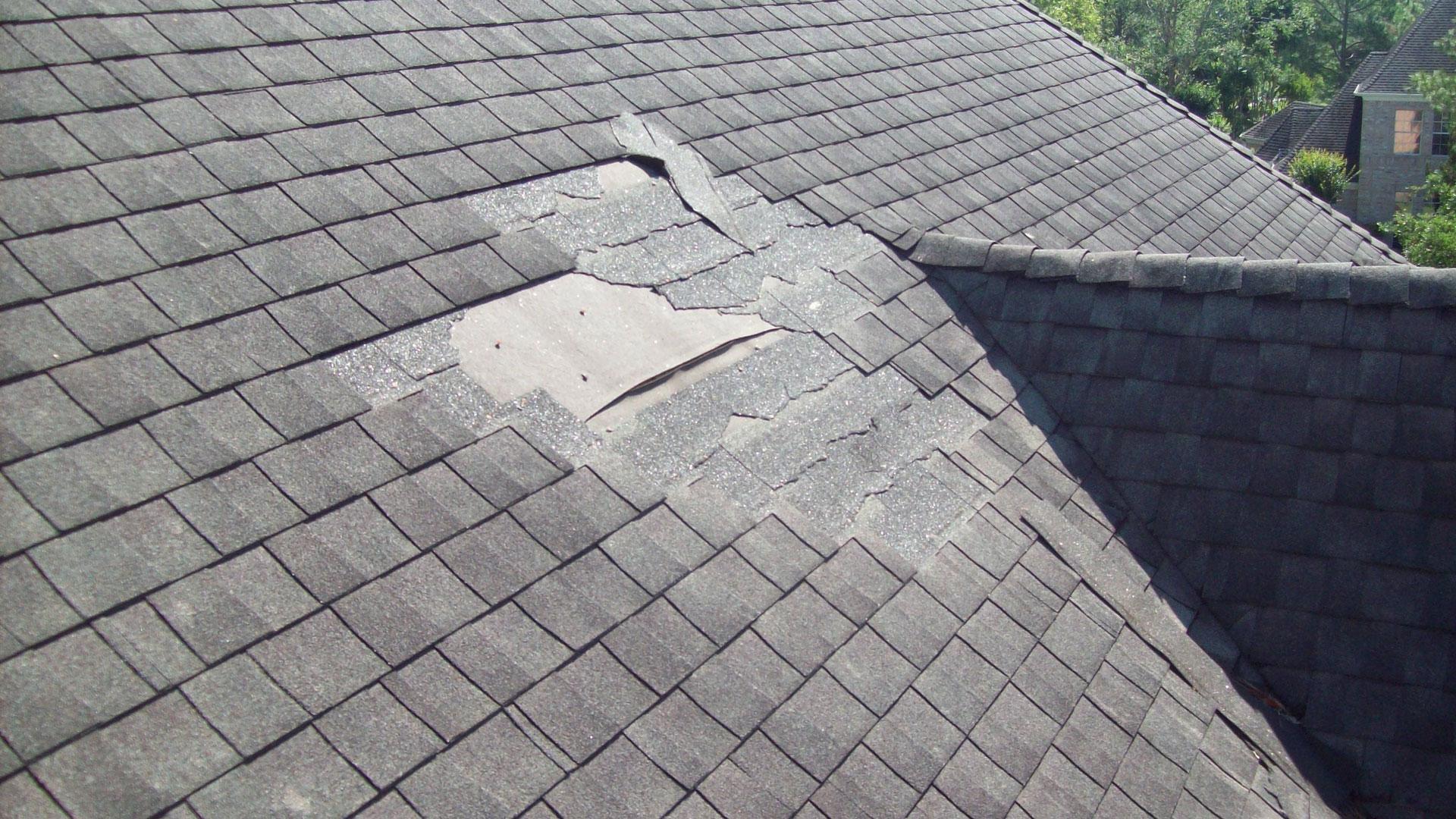 Home in need of roof repair due to mising shingles