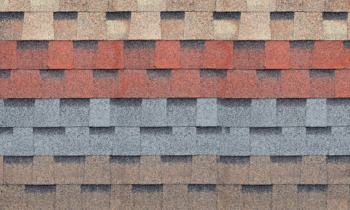 Different colored shingles displayed as options for Houston roof replacement