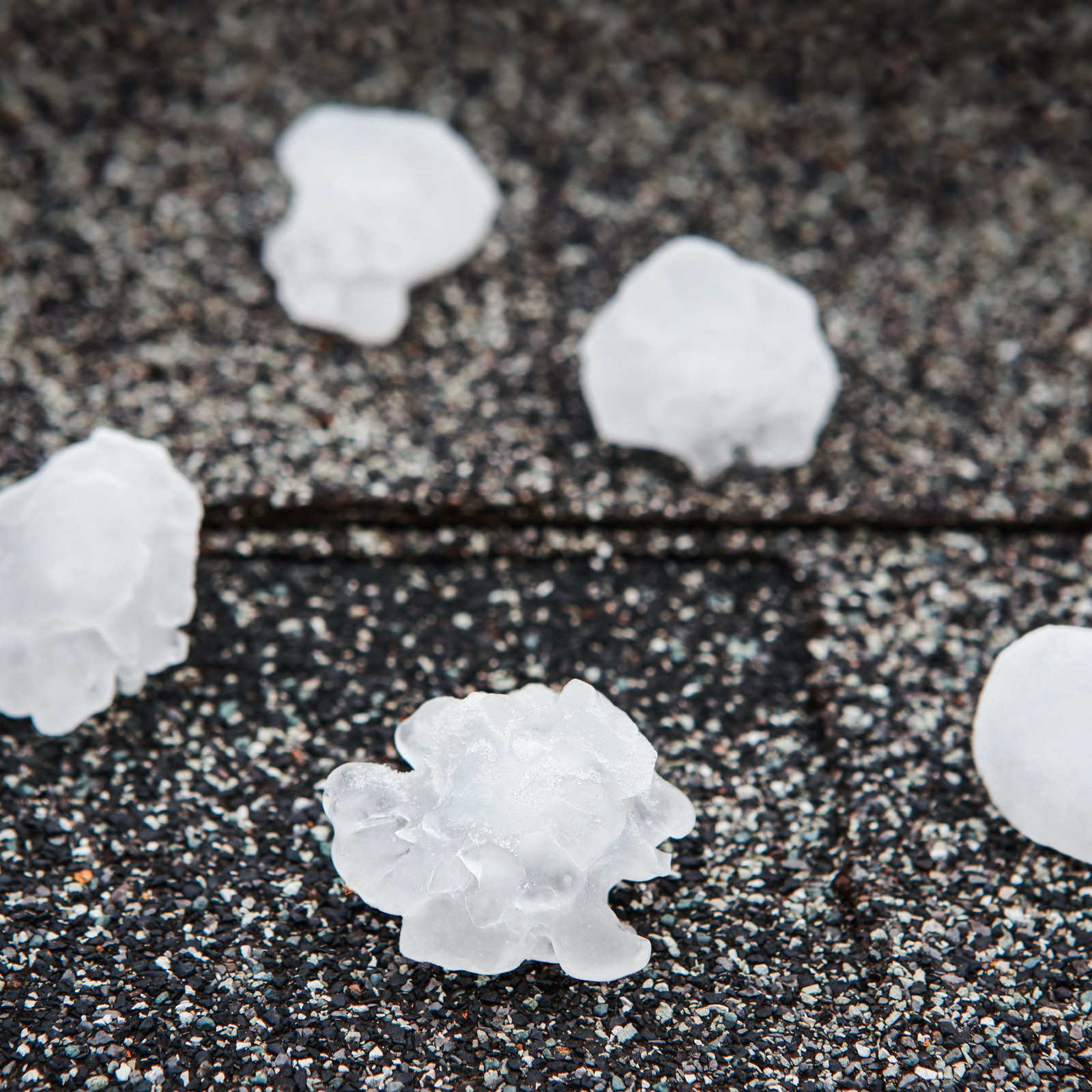 hail stones on top of a copperfield place roof causing damage