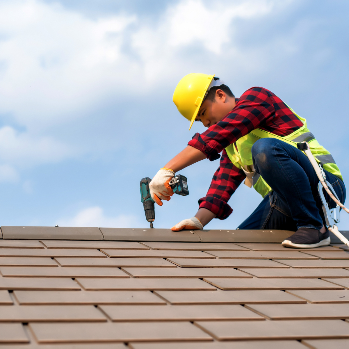 A Houston roofing company contractor conducts Sugar Land roof repairs.