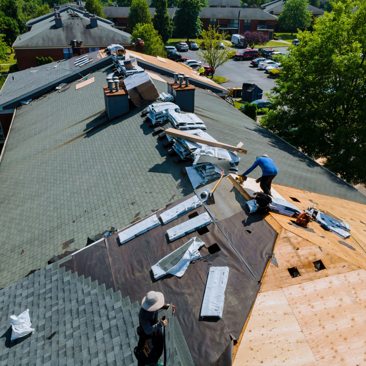 A team of expert Houston roofers from Amstill Roofing performing a Tomball roof replacement.