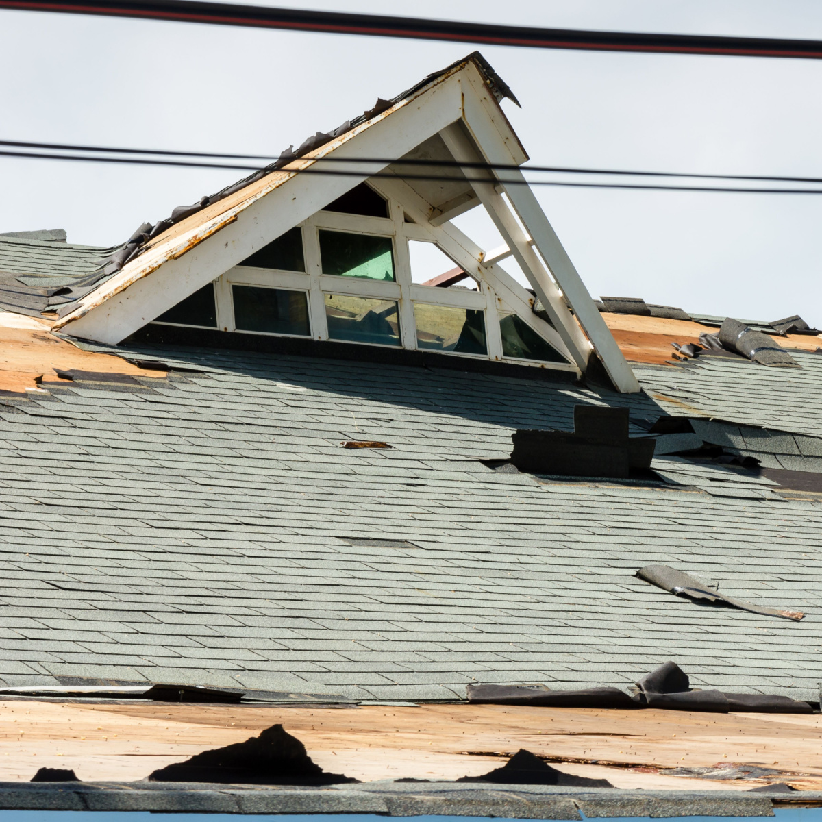 Houston roof shows extensive damage after it was hit by a hurricane.
