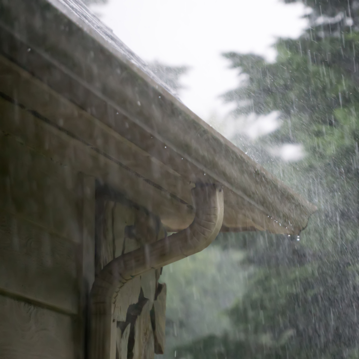 Rain pouring on an old roof