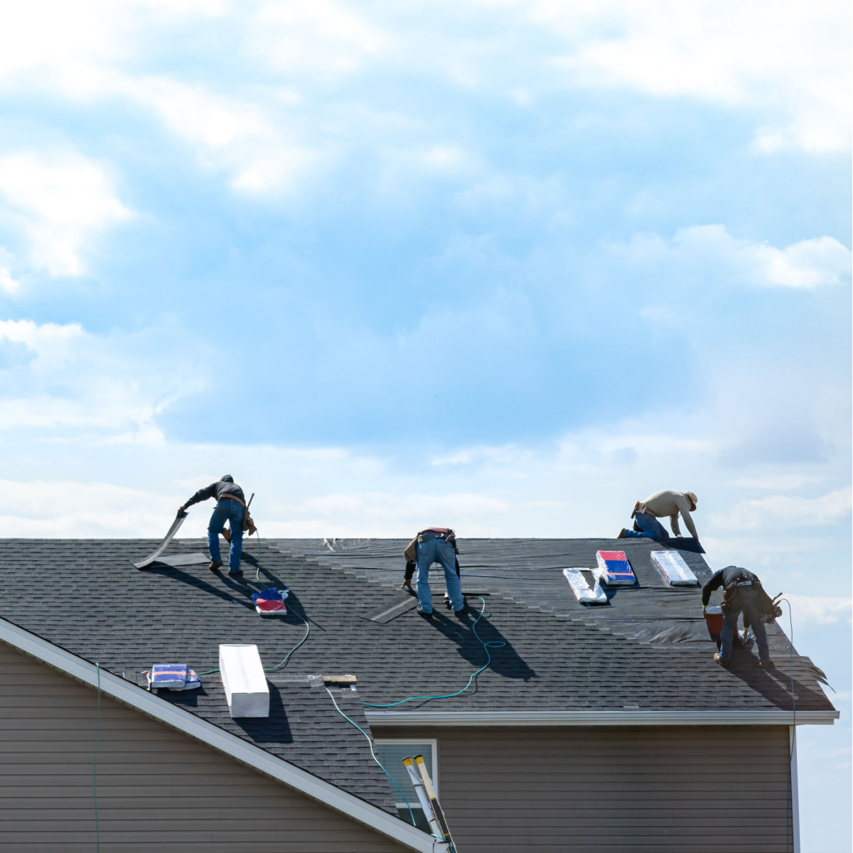 A team of Houston roof experts from Amstill Roofing performing a Meadows Place Roof Repair.
