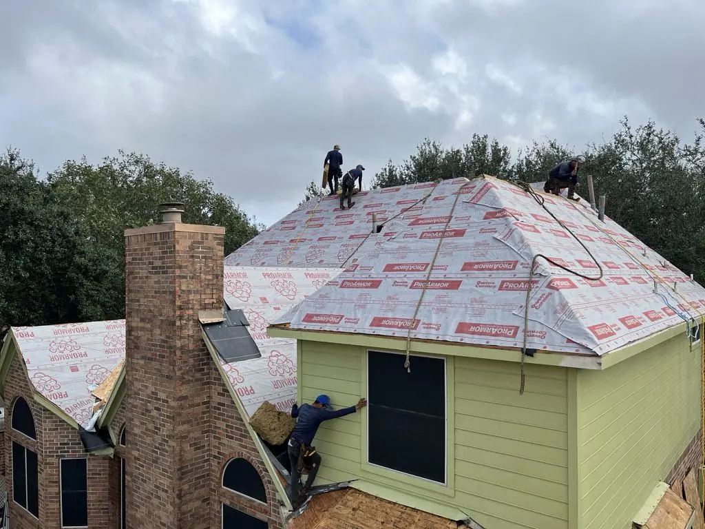 Houston roofing contractors completing a free league city roof replacement for a veteran
