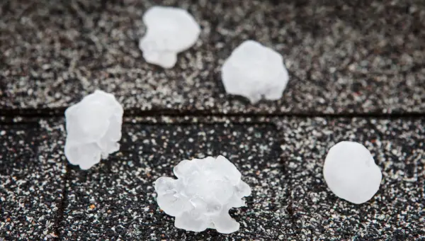 Hailstones sitting on Houston roofing surface